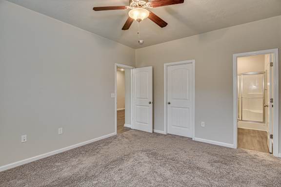 Carpeted bedroom with ceiling fan at Barrington Apartments, South Carolina, 29649