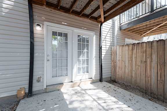 white door with a black frame is on the left side of the image at Sanctuary Apartments and Townhomes, Georgia