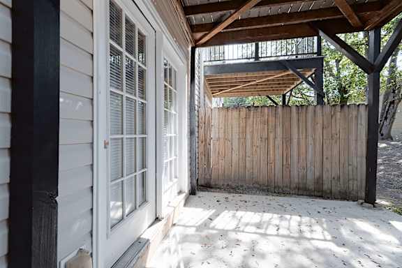 wooden deck with a white door at Sanctuary Apartments and Townhomes, Georgia, 30909