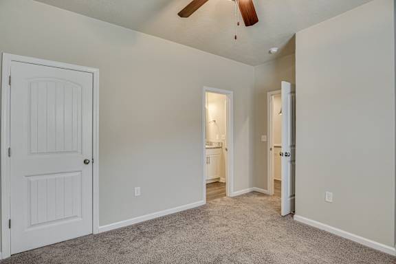 Carpeted bedroom with ceiling fan at Barrington Apartments, South Carolina, 29649