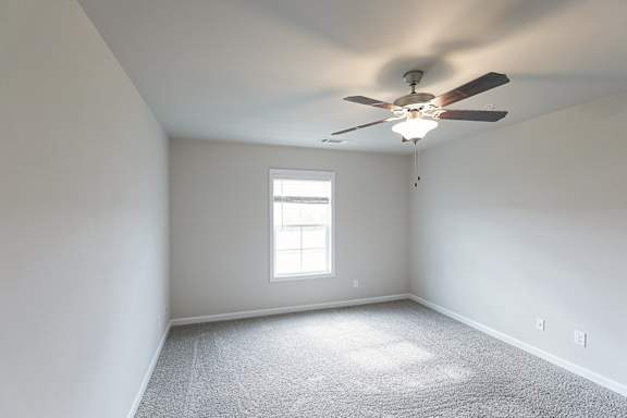 Room with ceiling fan and light at The Vista Apartments &amp; Townhomes, Warrenville, South Carolina