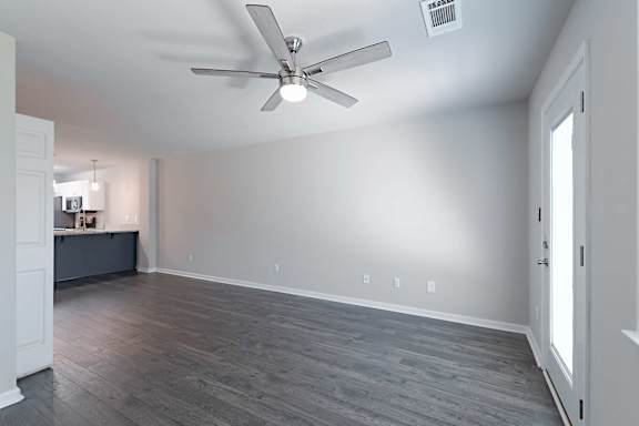 White ceiling fan with wooden floor at Sanctuary Apartments and Townhomes, Augusta, 30909