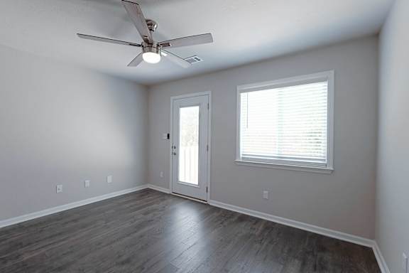 White room with window and glass door at Sanctuary Apartments and Townhomes, Augusta, GA