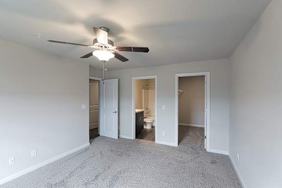 Room with ceiling fan and lights at The Vista Apartments &amp; Townhomes, Warrenville, SC