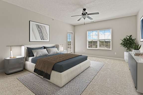 Spacious bed, painting in bedroom at The Vista Apartments &amp; Townhomes, South Carolina