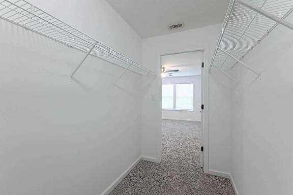 a room with white walls and a closet and a window at Sterlington Apartments, Georgia, 30813