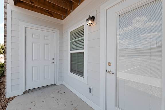 white door with a window above it at The Vista Apartments &amp; Townhomes, South Carolina