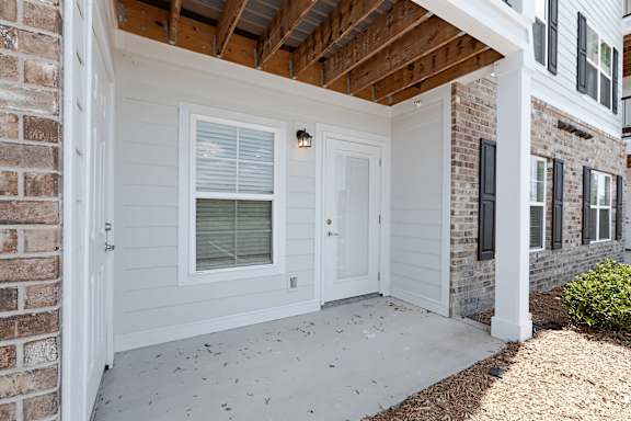 White wall and door with window at The Vista Apartments &amp; Townhomes, South Carolina, 29851