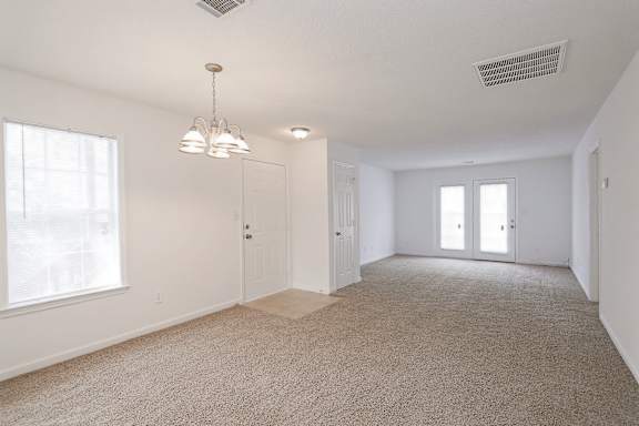 Grey carpet in a large living room at Sanctuary Apartments and Townhomes, Augusta