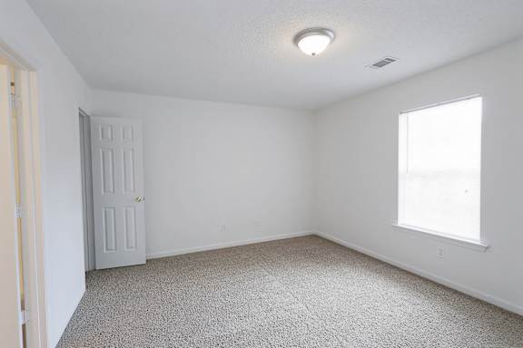 room with a door, and a window at Sanctuary Apartments and Townhomes, Georgia
