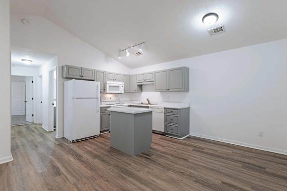 a kitchen with white cabinets and stainless steel appliances at Sterlington Apartments, Grovetown, GA