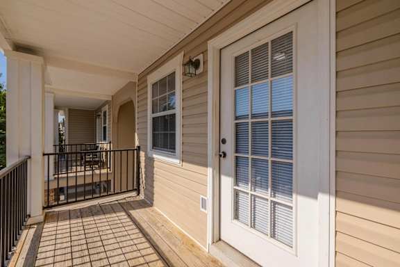 the front porch of a home with a white door at Sterlington Apartments, Grovetown, GA, 30813