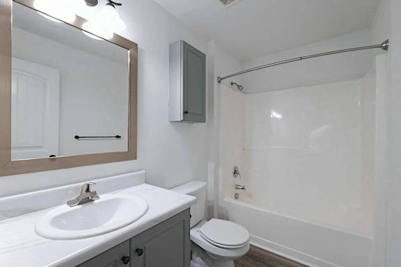 a bathroom with a sink and a toilet and a shower at Sterlington Apartments, Grovetown, Georgia
