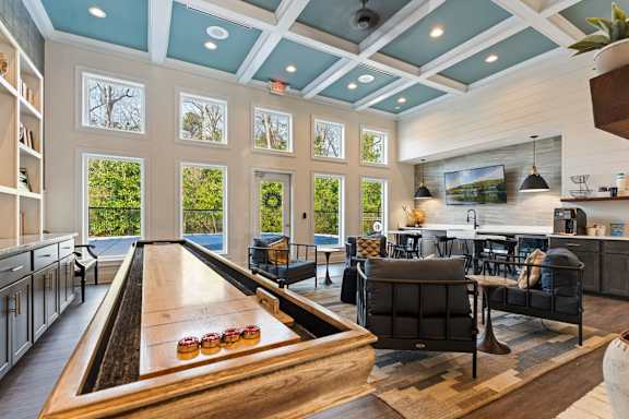 A billiard table is in the middle of a room with a pool table at Helena Springs, Georgia