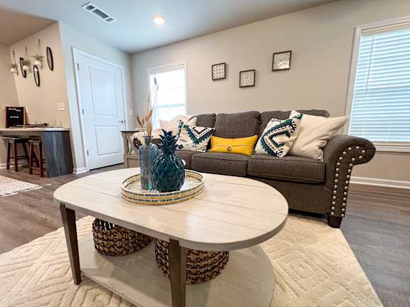 Furnished living area in a studio apartment at The Vista Apartments &amp; Townhomes, Warrenville, SC