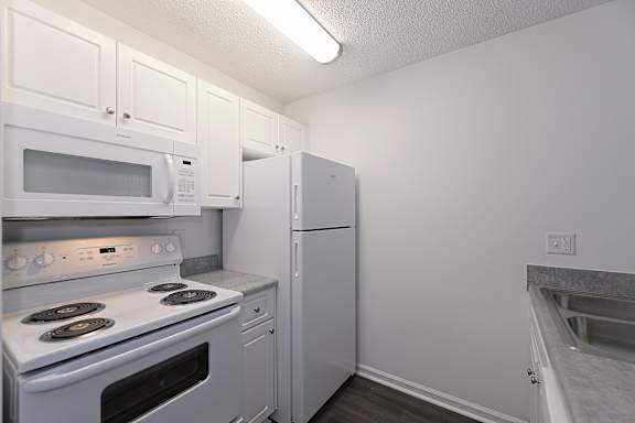Elegant simple kitchen with fridge at Sanctuary Apartments and Townhomes, Georgia, 30909