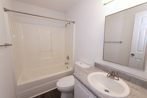 Simple clean bathroom with white interior at Sanctuary Apartments and Townhomes, Augusta Georgia