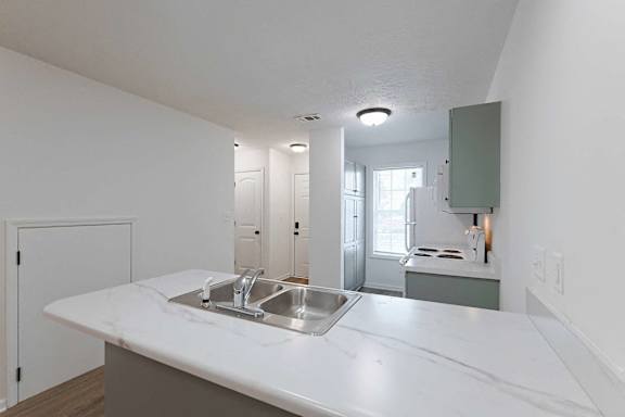 Kitchen with newly painted cabinets at Sterlington Apartments, Georgia
