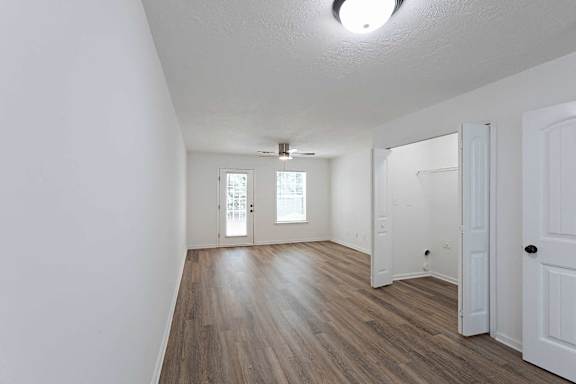 Living area with hardwood-style flooring at Sterlington Apartments, Grovetown, GA