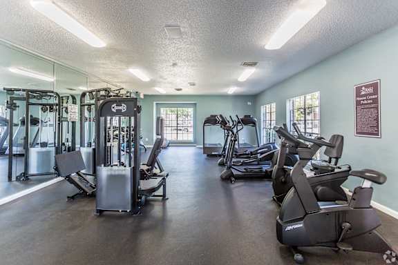 a gym with cardio machines and other exercise equipment The Trails at Mt. Moriah in Memphis, Tennessee