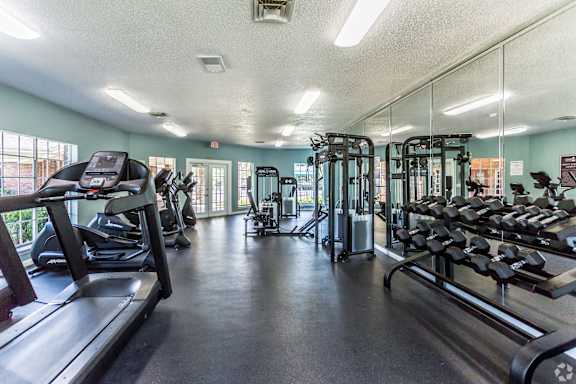 state of the art fitness center with weights and cardio equipment at The Trails at Mt. Moriah Memphis TN