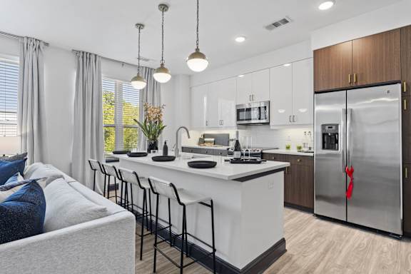 a kitchen with a large island and a refrigerator