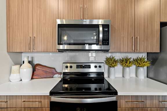 a kitchen with a stove and a microwave