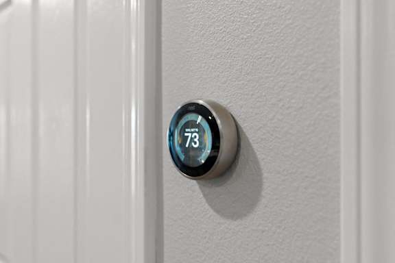 a digital thermostat on the side of a door