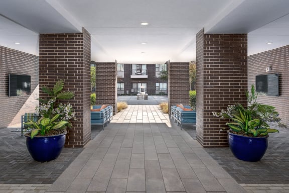 a view of the lobby of a building with blue planters