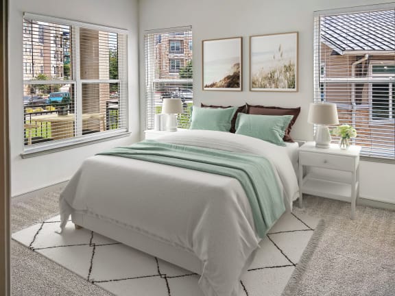 bedroom with art and bright windows