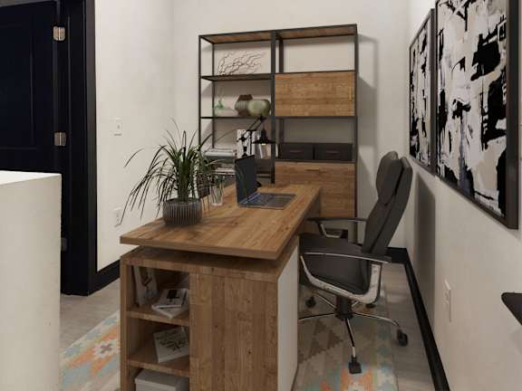 A room with a desk and a chair.