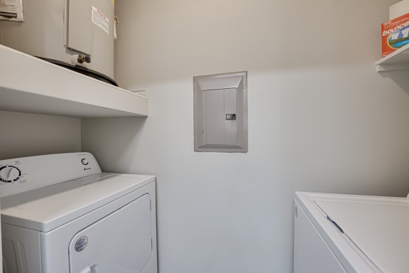 Laundry room with a washer and dryer at Highland Luxury Living, Lewisville, Texas