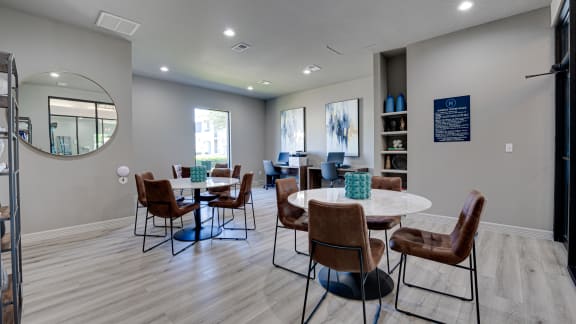 Clubhouse with tables at Highland Luxury Living, Lewisville, Texas