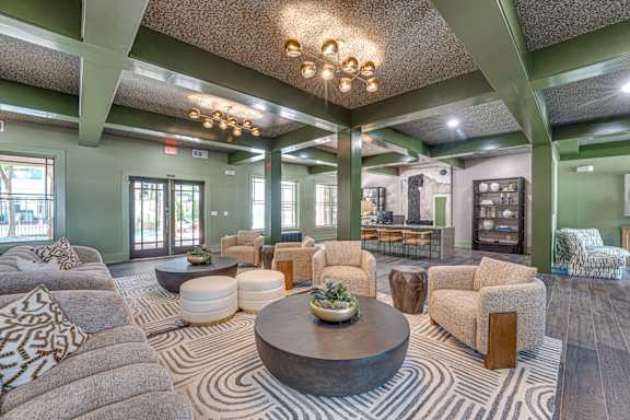 A living room with a large coffee table and a variety of seating options.