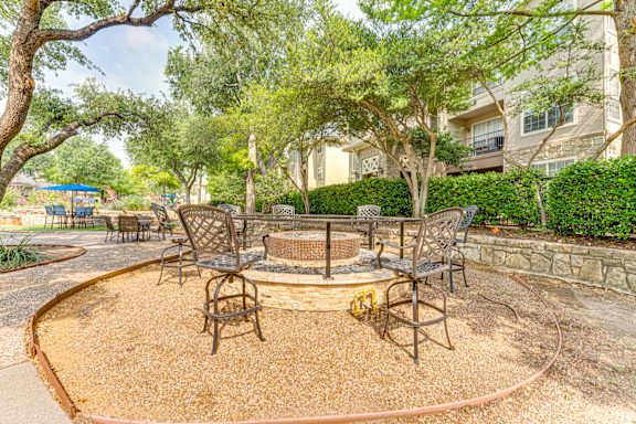 Backyard with a Fire Pit at The Brazos Apartments, Dallas