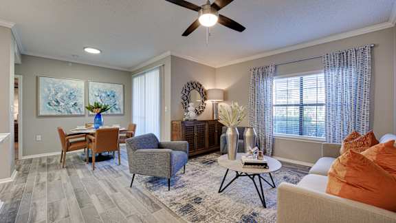 Open living and dining area with modern furnishings at Carmel Creekside Apartments, Fort Worth, Texas