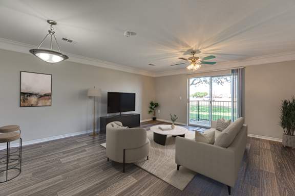 Living room with a television at Cleburne Terrace Apartments, Texas, 76033