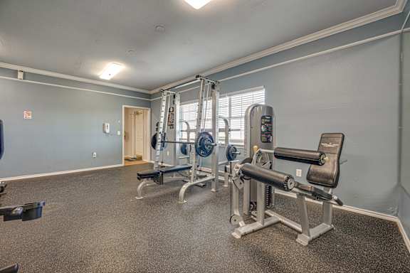 Gym with variety of equipment at Cleburne Terrace Apartments, Cleburne, Texas