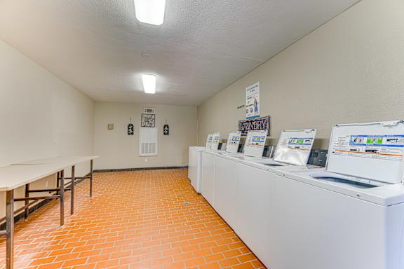 Row of Washers and Dryers at Copper Hill Apartments, Bedford