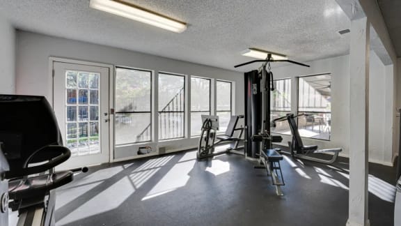 Fitness Center with Equipment at  Indian Creek Apartments in Carrollton, TX