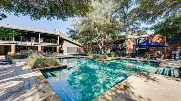 Resort style swimming pool at  Indian Creek Apartments in Carrollton, TX