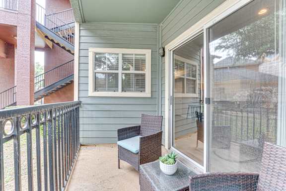 A patio with a table and chairs is shown.