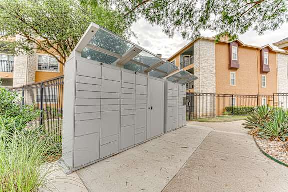 Package locker system with covered canopy at Limestone Ranch Apartments, Texas, 75067