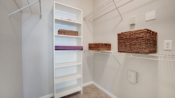 a walk in closet with white walls and shelves  at Limestone Ranch, Lewisville