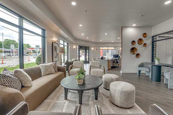 Bright lobby with comfortable seating and modern decor at The Montrose Apartments, Dallas