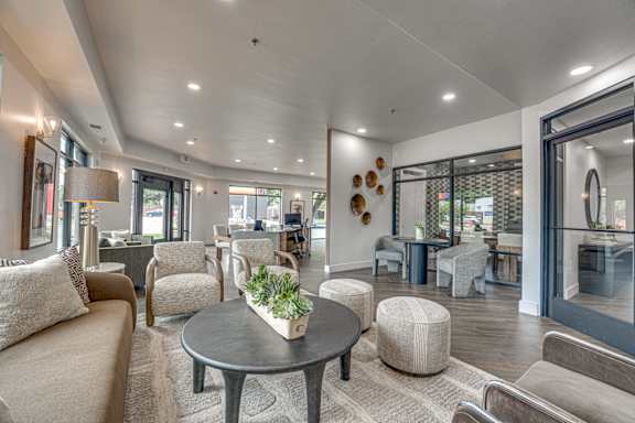 Spacious community lounge with comfortable seating areas at The Montrose Apartments, Texas