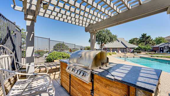 hot tub sits under a pergola at Paces Crossing, Denton, TX