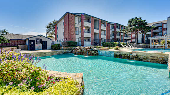 pool surrounded by variety of plants at Paces Crossing, Denton, TX 76210