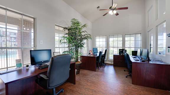 Brown color floor, computer and chair at Paces Crossing, Denton Texas