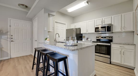 a kitchen with white cabinets and a counter top  at Limestone Ranch, Lewisville, 75067